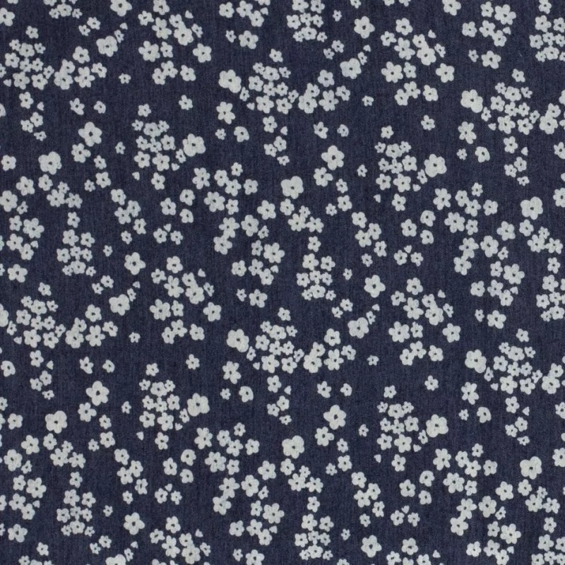 Donkerblauwe stretch denim jean stof kleine witte bloemen | Wolf Stoffen