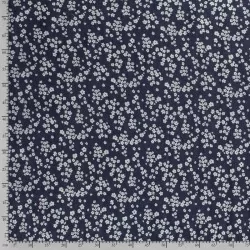Donkerblauwe stretch denim jean stof kleine witte bloemen | Wolf Stoffen
